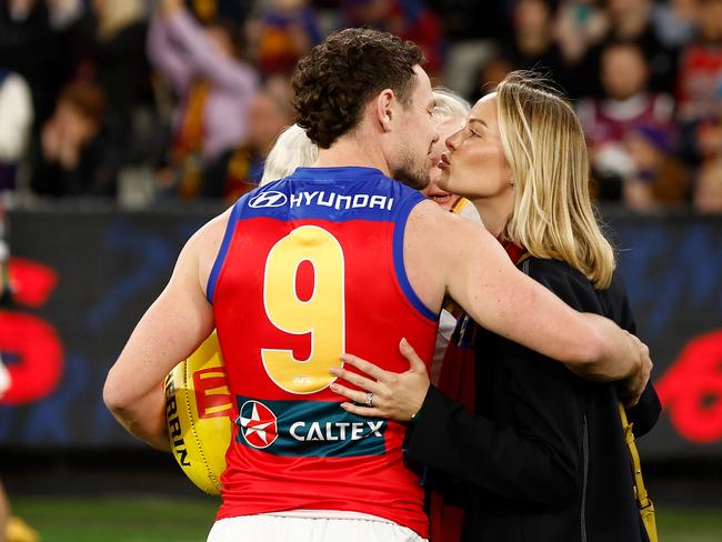 MELBOURNE, AUSTRALIA - APRIL 11: Lachie Neale of the Lions and wife Jules embrace before his 250th match during the 2024 AFL Round 05 match between the Melbourne Demons and the Brisbane Lions at the Melbourne Cricket Ground on April 11, 2024 in Melbourne, Australia. (Photo by Michael Willson/AFL Photos via Getty Images)