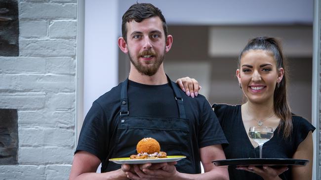 The Brompton chef Andrew Wandless holds his signature chicken Kyiv; alongside duty manager Emmy Thomson. Picture: Emma Brasier