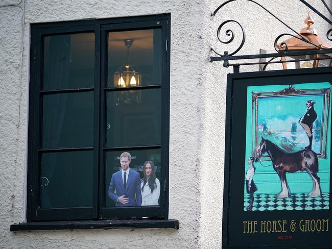 A picture of Prince Harry and Meghan Markle is displayed in the window of the Two Brewers Pub in Windsor. Picture: Christopher Furlong/Getty Images