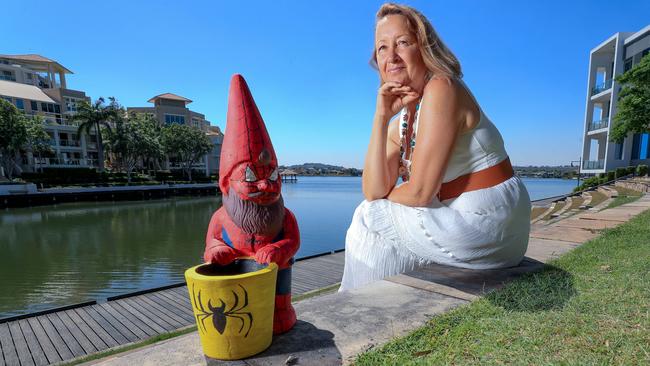 Chantal Clarke with one of the gnomes at Varsity Lakes. Picture: Tim Marsden