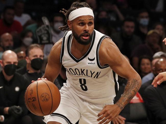 Patty Mills drained seven three-pointers on debut for his new team.