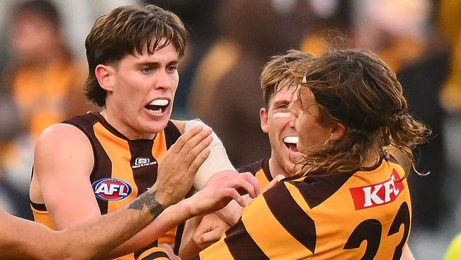 MELBOURNE, AUSTRALIA - JUNE 01: Will Day and Jack Ginnivan of the Hawks react after Ginnivan kicked a goal just before three quarter time during the round 12 AFL match between Hawthorn Hawks and Adelaide Crows at Melbourne Cricket Ground, on June 01, 2024, in Melbourne, Australia. (Photo by Morgan Hancock/AFL Photos/via Getty Images)