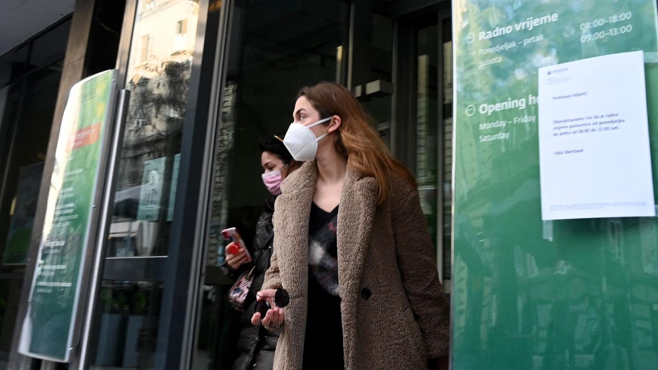 Citizens wait in front of the entrance of a branch of the Russian Sbertbank in the centre of Zagreb on February 28, 2022. Picture: AFP