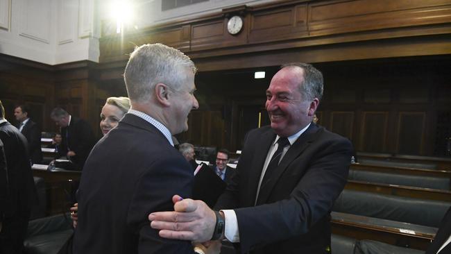 Nationals leader Michael McCormack, left, shakes hands with Drought Envoy Barnaby Joyce at the National Drought Summit in Canberra today. Picture: AAP