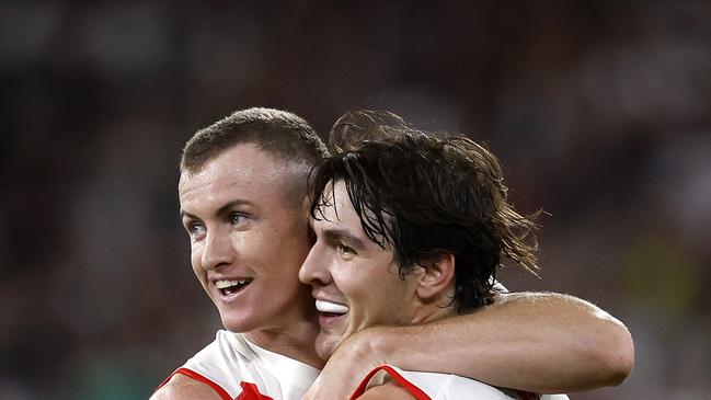 Sydney's Chad Warner and Errol Gulden celebrate setting up a goal to Logan McDonald during the Round 1 AFL match between the Collingwood Magpies and the Sydney Swans at the MCG on March 15, 2024. Photo by Phil Hillyard (Image Supplied for Editorial Use only – Phil Hillyard **NO ON SALES** – Â©Phil Hillyard )