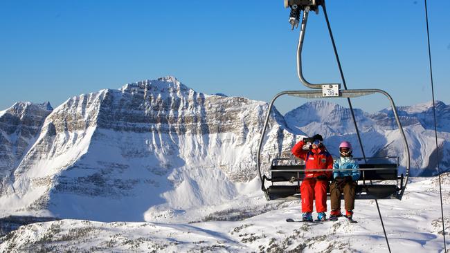 Riding a chairlift in Sunshine Village. Picture: Sean Hannah