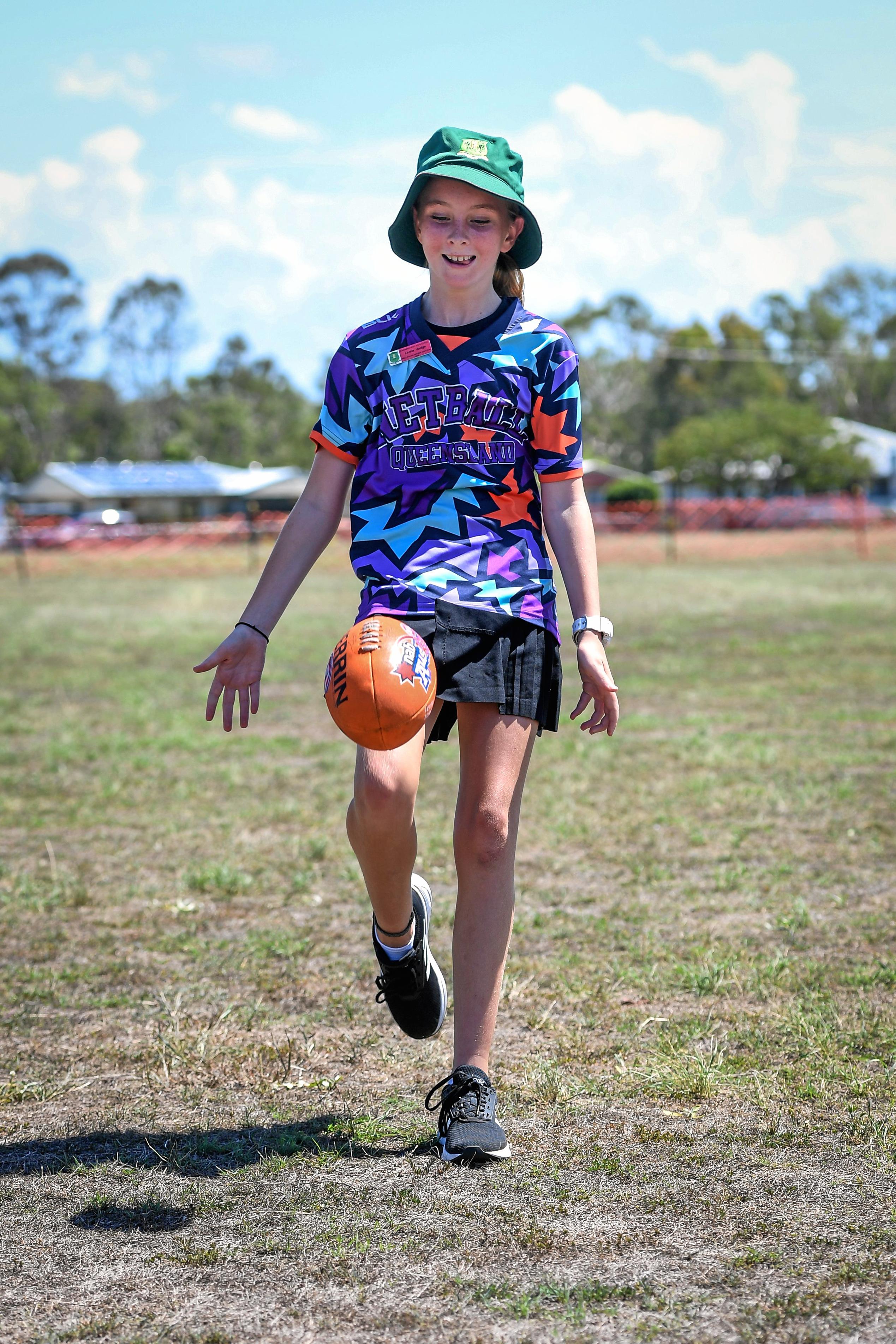 Richmond AFL fan, Larna Hodge, shows her skills kicking the Sherrin. Picture: Brian Cassidy