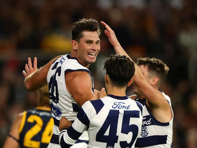 Tom Hawkins celebrates a goal with Brad Close and Shaun Mannagh during the Cats’ win over the Crows. Picture: Sarah Reed/AFL Photos via Getty Images.