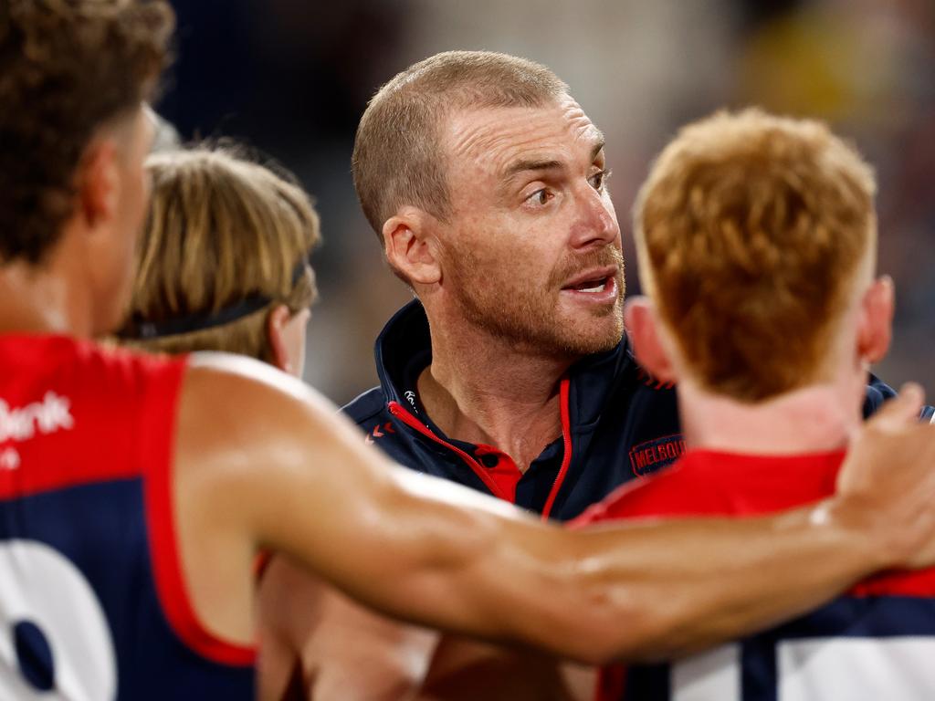 Simon Goodwin addresses his players during their loss to Geelong.