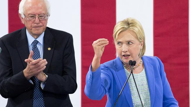 Hillary Clinton speaking as Bernie Sanders applauds at a rally in Portsmouth, New Hampshire during the 2016 race. Picture AFP.