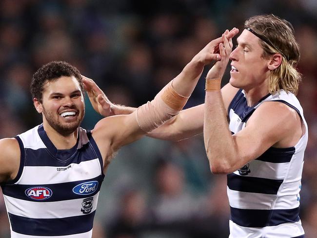 ADELAIDE, AUSTRALIA - JUNE 10: Brandan Parfitt of the Cats celebrates a goal with Mark Blicavs during the 2021 AFL Round 13 match between the Port Adelaide Power and the Geelong Cats at Adelaide Oval on June 10, 2021 in Adelaide, Australia. (Photo by Sarah Reed/AFL Photos via Getty Images)