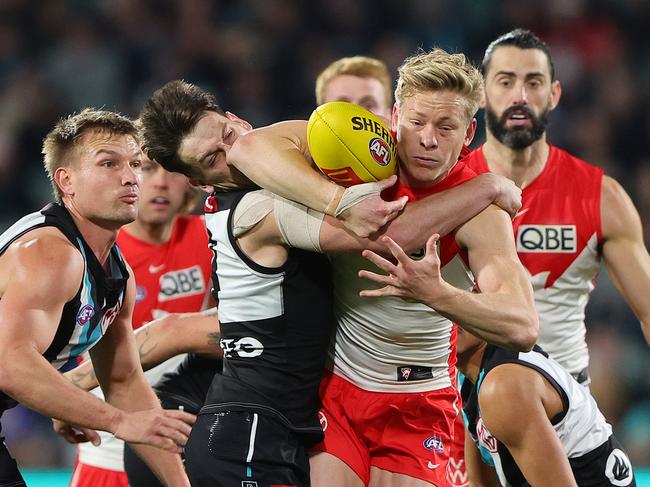 It’ll be hot in the middle when these midfields collide. Picture: Sarah Reed/AFL Photos via Getty Images