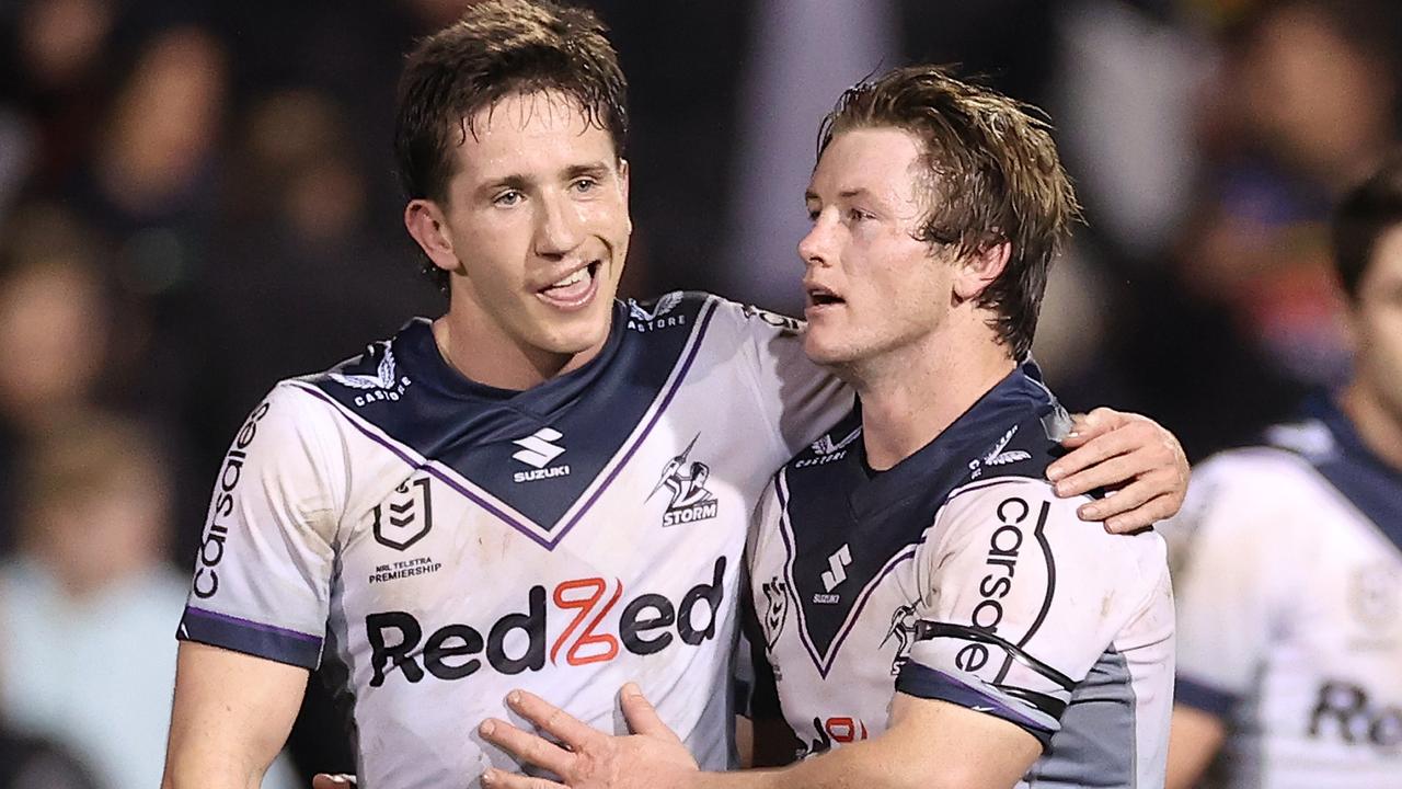 PENRITH, AUSTRALIA - AUGUST 11: Cooper Johns of the Storm and Harry Grant of the Storm celebrate at full-time during the round 22 NRL match between the Penrith Panthers and the Melbourne Storm at BlueBet Stadium on August 11, 2022, in Penrith, Australia. (Photo by Cameron Spencer/Getty Images)