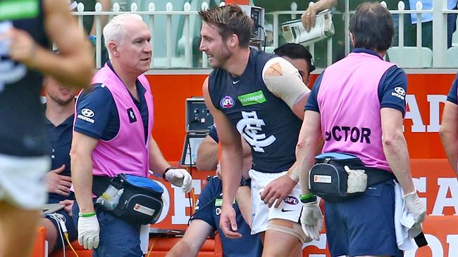 Dale Thomas on the bench after copping a knock to his elbow.