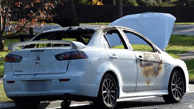 A burnt out car on Carramar Drive Frankston. Picture: Nicole Garmston