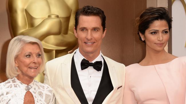 All patched up: Matthew McConaughey (centre) with mother Mary Kathlene (left) and wife Camila Alves at the 2014 Oscars. Picture: Getty