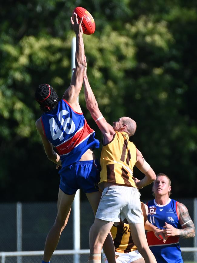 Caiden Gardiner jumps against Jarryd Flint during the AFL Cairns men match between the Manunda Hawks V Centrals Trinity Beach Bulldogs at the Trinity Beach Sports Club. Picture Emily Barker