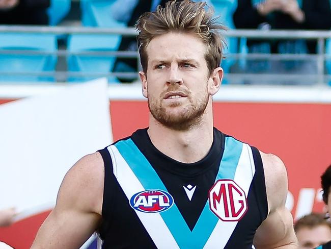 HOBART, AUSTRALIA - MAY 13: Tom Jonas of the Power leads his team on to the field during the 2023 AFL Round 09 match between the North Melbourne Kangaroos and the Port Adelaide Power at Blundstone Arena on May 13, 2023 in Hobart, Australia. (Photo by Dylan Burns/AFL Photos via Getty Images)