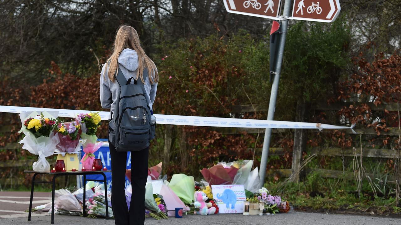 A young woman at a floral memorial near the scene of Ms Muprhy’s death in Tullamore. Picture: Charles McQuillan/Getty Images