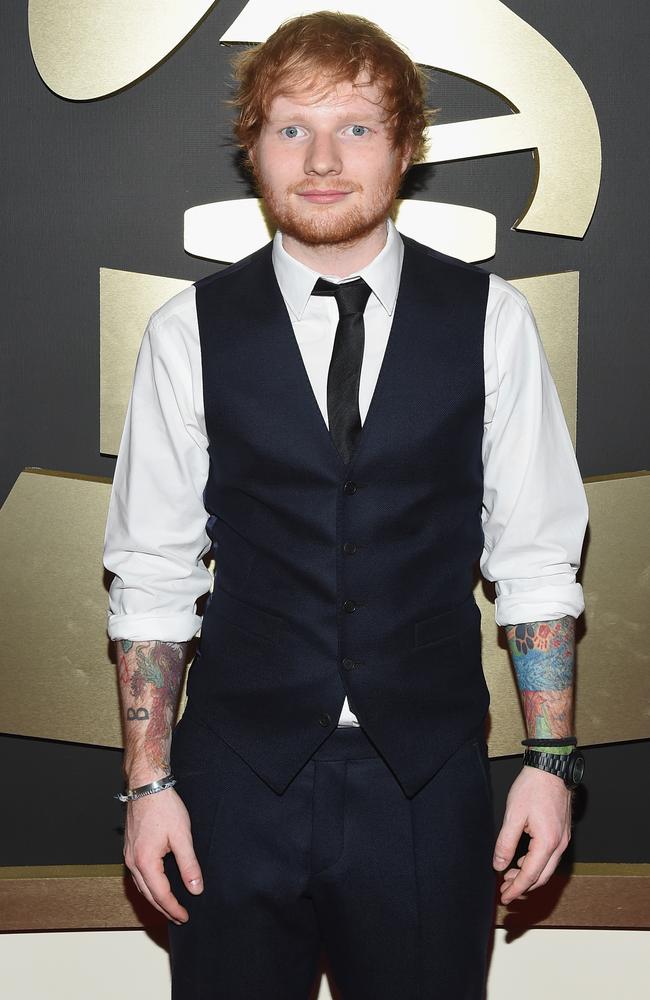 Showing off his tatts ... Recording Artist Ed Sheeran arrives on the red carpet.