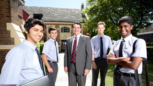 Brisbane Grammar School headmaster Anthony Micallef (centre) with (from left) students Ryan Hua, 16, Daniel Athanasellis, 17, Toby Taylor, 17, and Saravanan Somasundaram, 17. Picture: AAP/Steve Pohlner