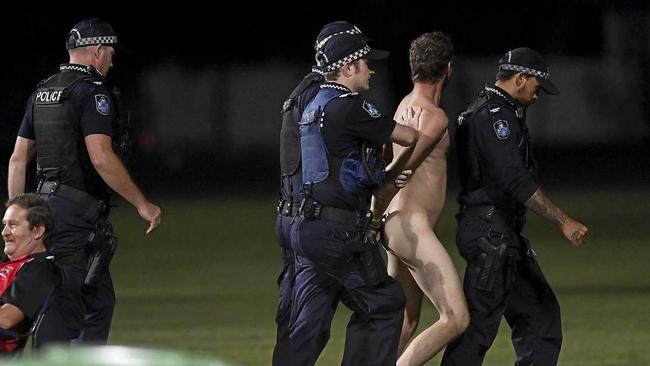 MACKAY, AUSTRALIA - MARCH 03: A streaker is lead away by police during the 2019 JLT Community Series AFL match between the Gold Coast Suns and the Western Bulldogs at Great Barrier Reef Arena on March 03, 2019 in Mackay, Australia. (Photo by Ian Hitchcock/Getty Images). Picture: Ian Hitchcock