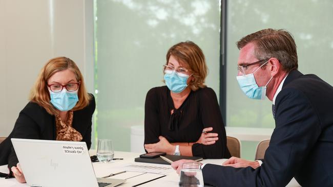 chief health officer Dr Kerry Chant, Deputy Secretary Patient Experience and System Performance Susan Pearce and Premier Dominic Perrottet meet at NSW Health headquarters in St Leonards. Picture: Justin Lloyd.