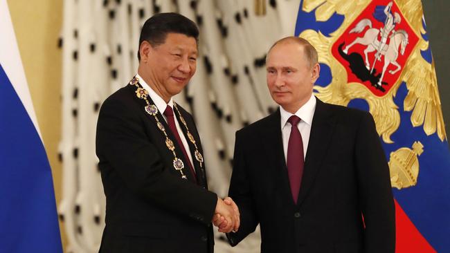 Chinese President Xi Jinping, pictured with Russian counterpart Vladimir Putin, last year spoke of China’s ambitious 30-year plan to become a superpower. Picture: Sergei Ilnitsky/AFP