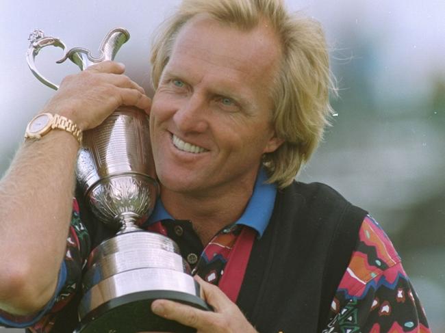 Golfer Greg Norman hugs the trophy after winning the British Open Championship at Royal St Georges club, Sandwich 18 Jul 1993.