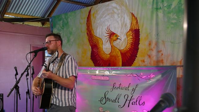 BREAKING THE RULES: Singer Jack Carty breaks one of his life rules by performing in shorts to beat the heat when the Festival of Small Halls came to Nymboida last year.