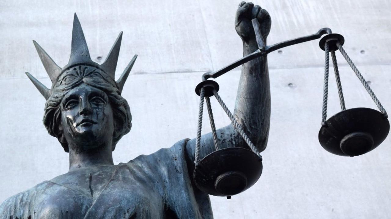 An alleged senior founding figure of a Queensland extremist group has been charged with bankrolling a foreign fighter who went on to fight in Syria.