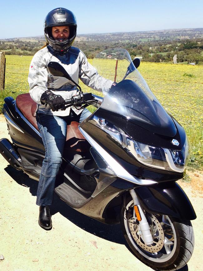 Maritha Keyser with her bike, in the same protective clothing she was wearing during the crash.