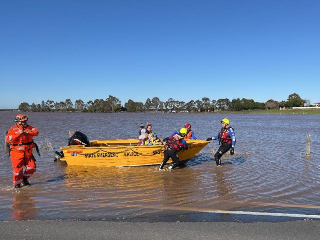 A still from FRNSW footage of a rescued mother and her two toddlers from floods in Millers Forest on an isolated farm. Picture: FRNSW