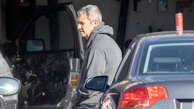 ACT chief prosecutor Shane Drumgold enjoys an early-afternoon beer in the driveway of his Canberra home. Picture: Liam Mendes