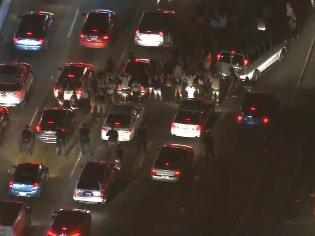 Police try to disperse protesters. Picture: CBS12.com