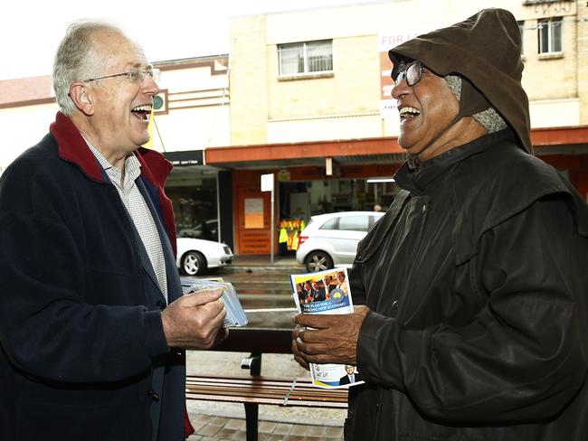 Liberal candidate for Kingsford Smith Dr Michael Feneley shares a laugh with Prem Maharaj while on the hustings outside Royal Randwick Shopping Centre. Picture: John Appleyard