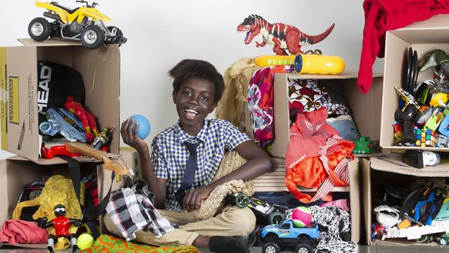 Anade Oboya has collected nine boxes of toys, clothes and shoes to give away to The Salvation Army as part of his Give Half Project. Picture: AAP/Renae Droop