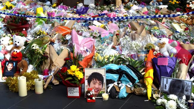 A flower memorial on the corner of Bourke St and Elizabeth St to remember those killed and injured on Friday. Picture: Nicole Garmston