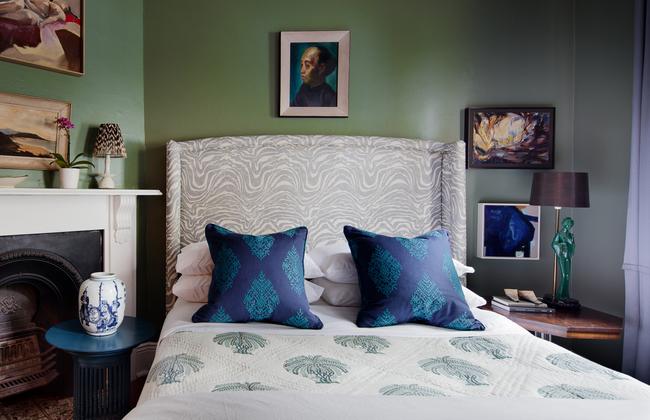 Interior designer Karen Akers says blue and green are great choices for bedrooms because they are so restful. Here, they are in equally deep hues for balance. Picture: Thomas Dalhoff