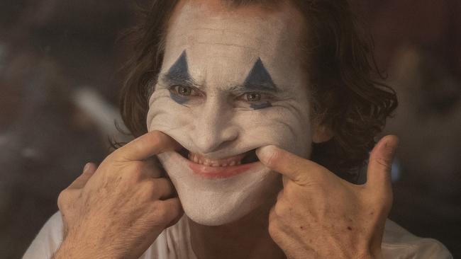 This image released by Warner Bros. Pictures shows Joaquin Phoenix in a scene from "Joker," in theaters on Oct. 4.  (Niko Tavernise/Warner Bros. Pictures via AP)