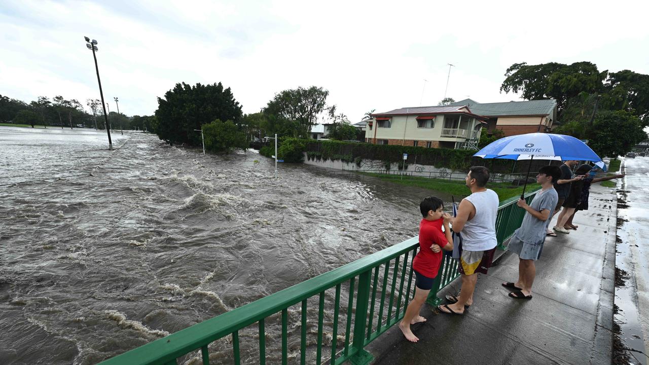 Flash flooding in Thompson Estate reserve and on the corner of Juliette St and Earle St. Picture: Lyndon Mechielsen/Courier Mail