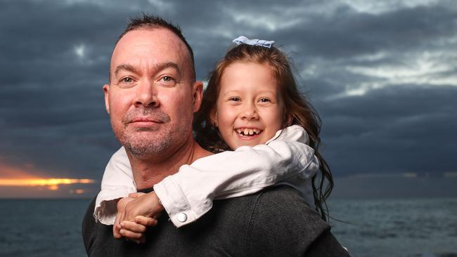 Jase Shore with daughter Lily at Brighton Beach. Picture Matt Turner.