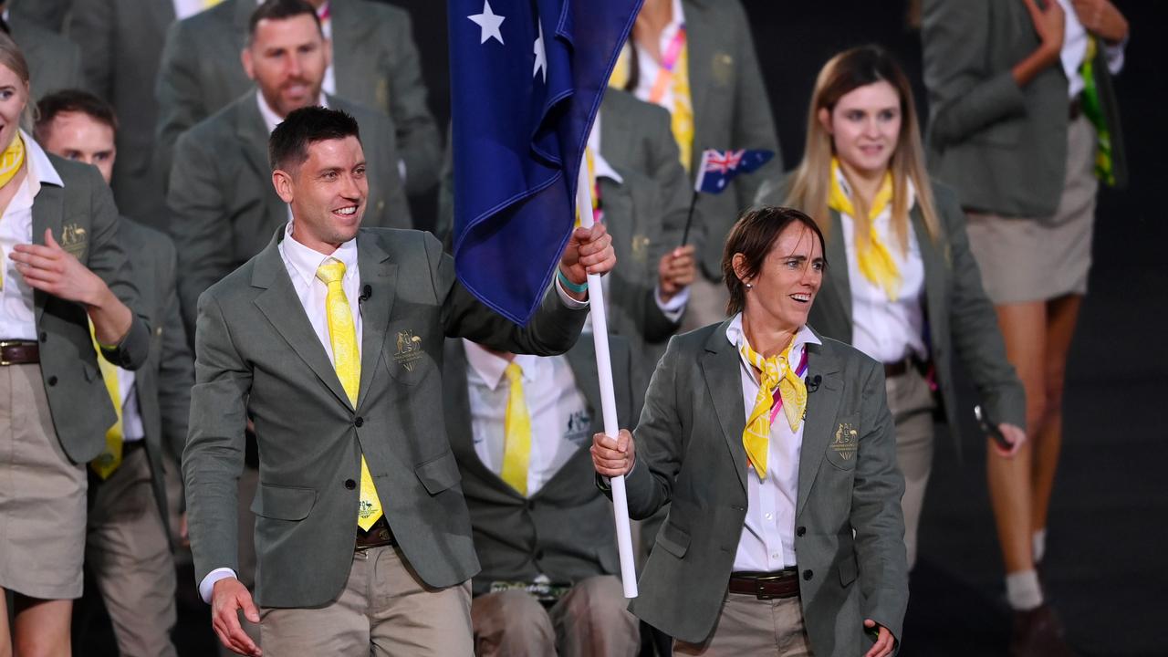 Eddie Ockenden and Rachael Grinham carried the Aussie flag into the Birmingham Commonwealth Games opening ceremony. Photo by Alex Davidson/Getty Images.