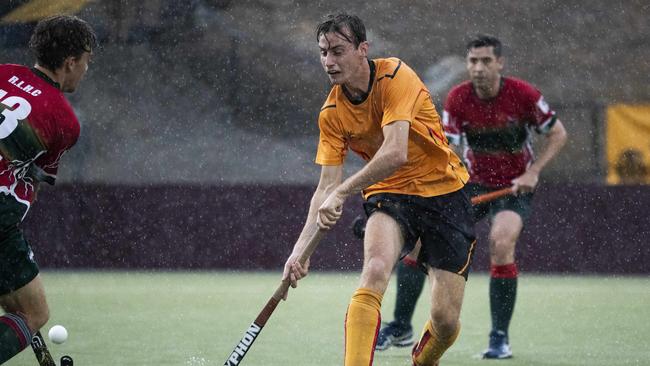 The intensity of the rain can be seen as Easts’s Ollie Prest makes his way through the big wet. Picture: Renae Droop