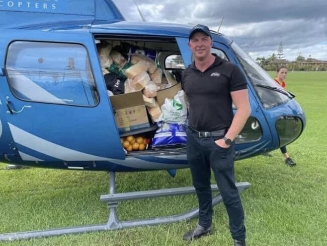 Chief pilot of Sea World helicopters, Ash ‘Jenko’ Jenkinson, delivering vital supplied to stranded flood victims during the 2022 Northern Rivers flood disaster. Picture: Deanie White