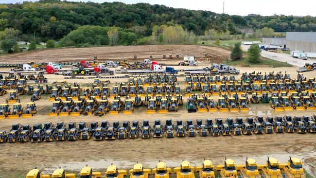 Construction and farming vehicles manufactured by John Deere sit in a yard at the John Deere Dubuque Works facility on October 15, 2021 in Dubuque, Iowa. More than 10,000 John Deere employees have been striking since October 14. Picture: Scott Olson/Getty Images/AFP