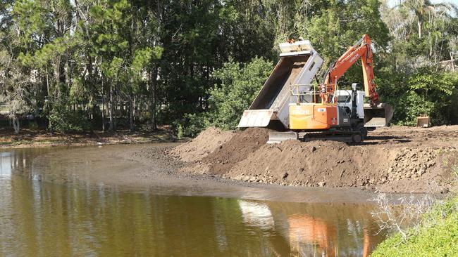 Black Swan Lake slowly being filled in by workmen at Bundall. Picture: Glenn Hampson