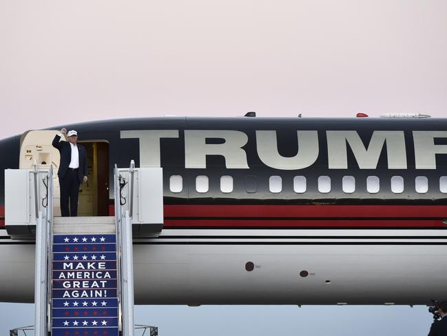 AFP PICTURES OF THE YEAR 2016 Republican presidential nominee Donald Trump waves as he steps out of his plane for a rally at the JetCenters of Colorado in Colorado Springs, Colorado on September 17, 2016. Photo: Mandel Ngan