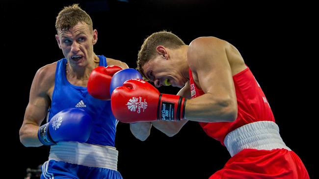 Northern Ireland boxer Sean McComb (left) in action against Luke McCormick of England earlier this week. Photo: Getty Images