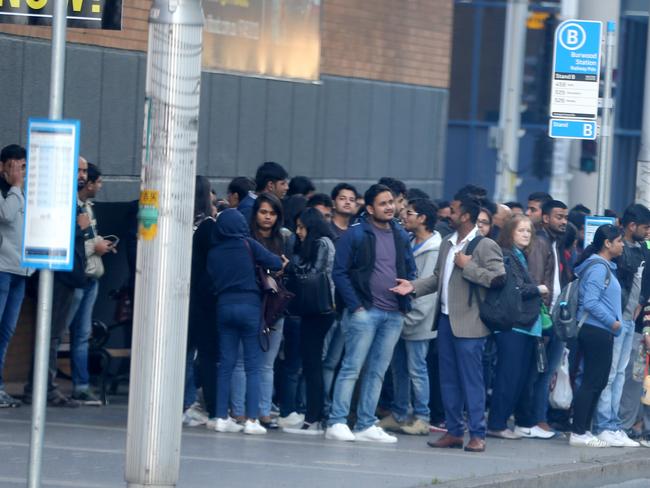 Commuters wait on Railway Rd, Burwood during the bus strike. Picture: John Grainger